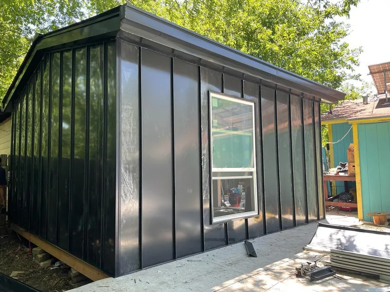 Black standing seam metal wall panels for Roof Inspection in San Fernando